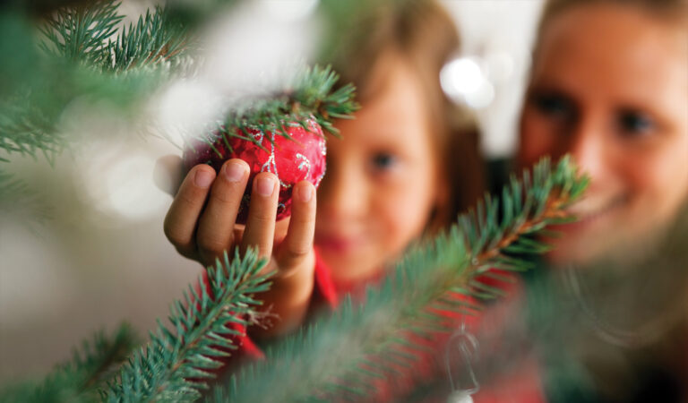 Parent and Child with Christmas Tree